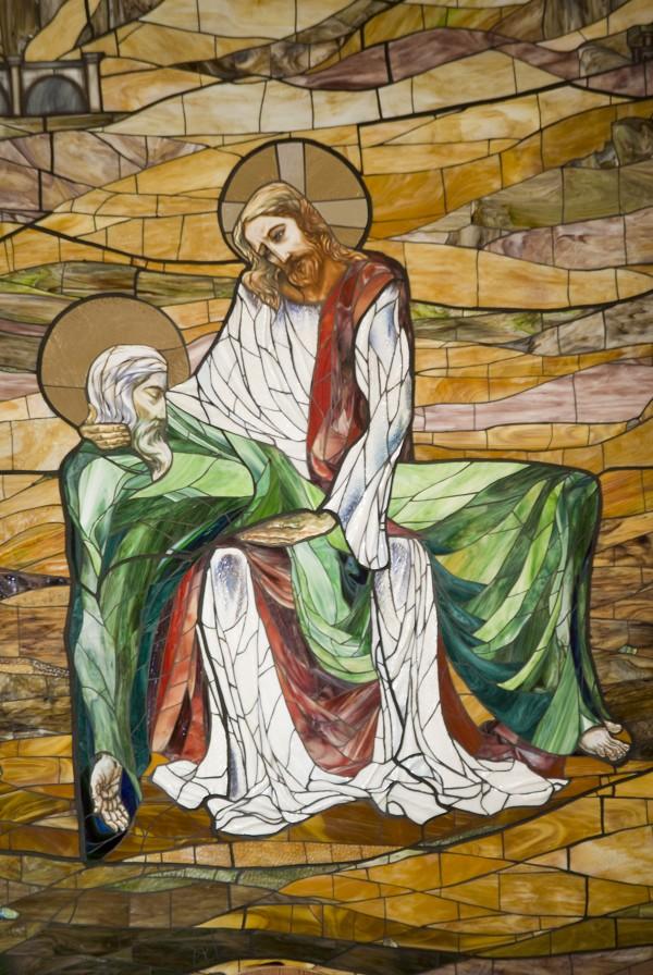 Stained-glass window of Christ embracing St. Bernard in the church