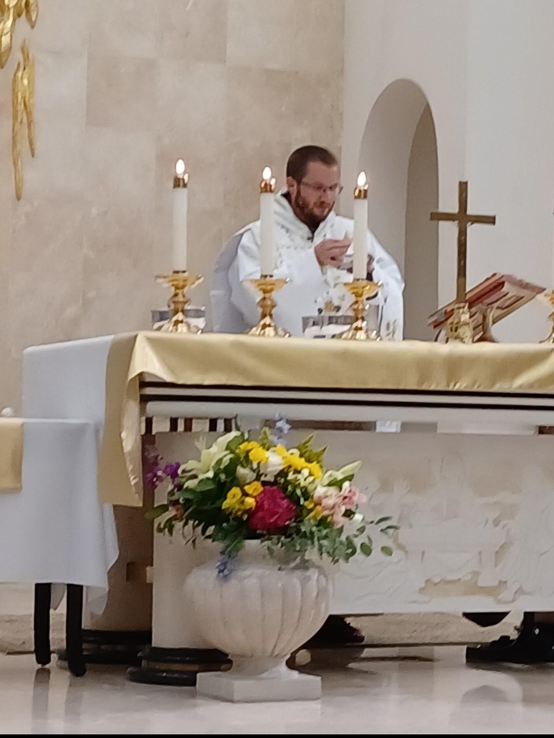 A priest celebrating Mass at the altar